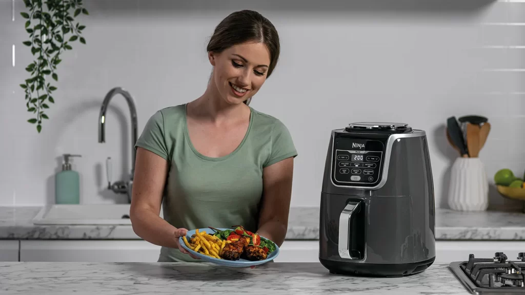 https://www.kitchenaddition.co.uk/wp-content/uploads/2022/10/Ninja_Air_Fryer_AF160UK_chicken_plated_with_product-1600x900-1-1024x576.webp